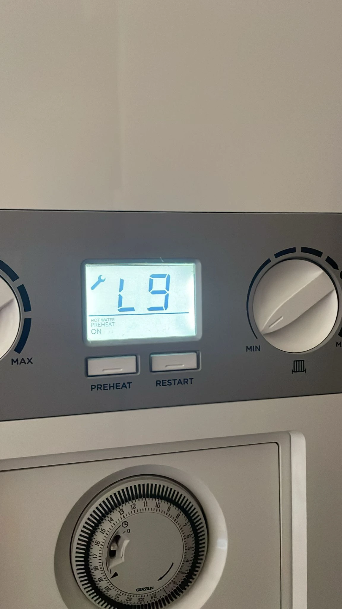 Gas Safe engineer repairing a combi boiler in Bolton. Diagnostics, parts replacement and safety checks