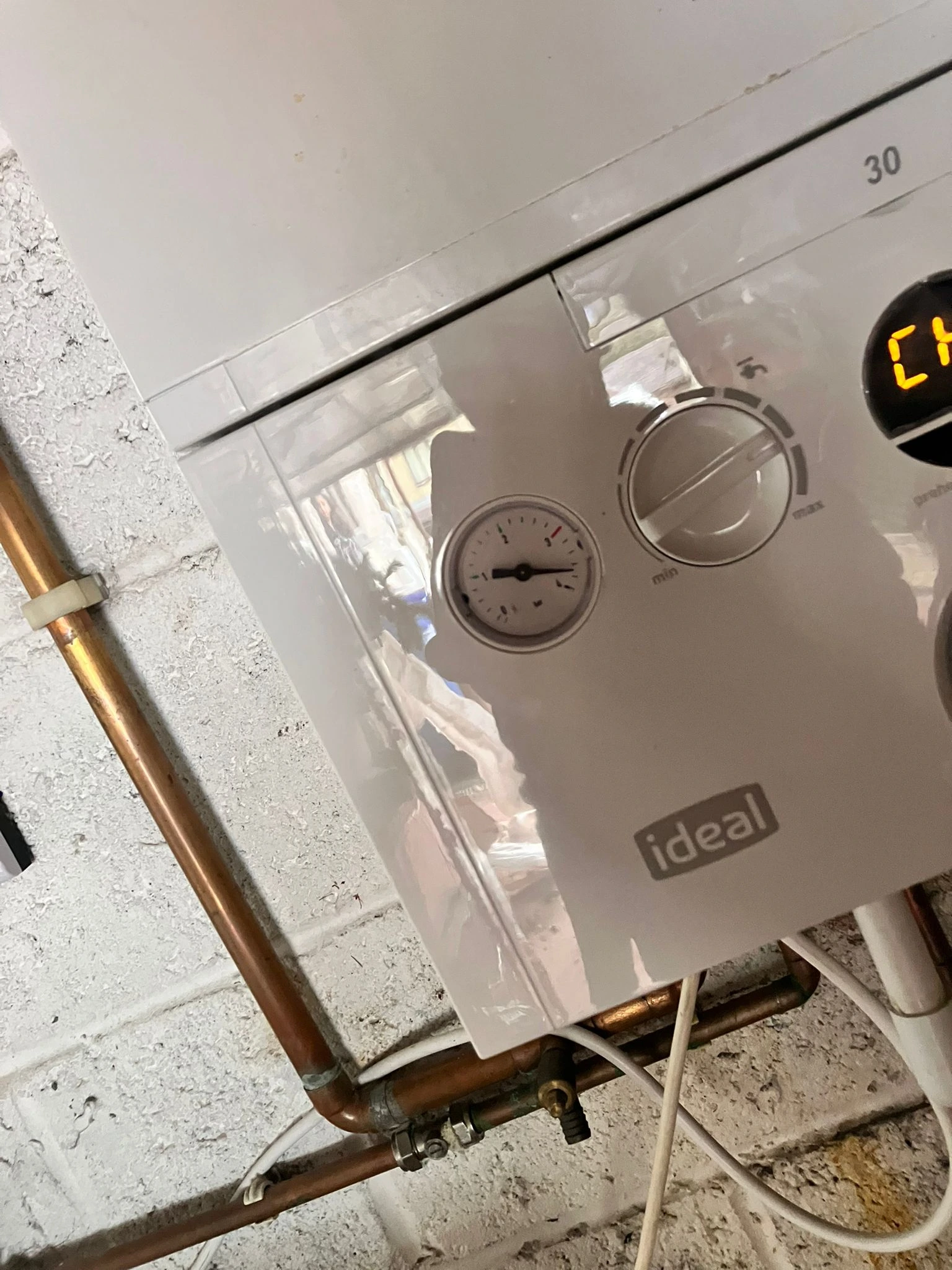 Gas Safe engineer repairing a combi boiler in Oldham. Diagnostics, parts replacement and safety checks