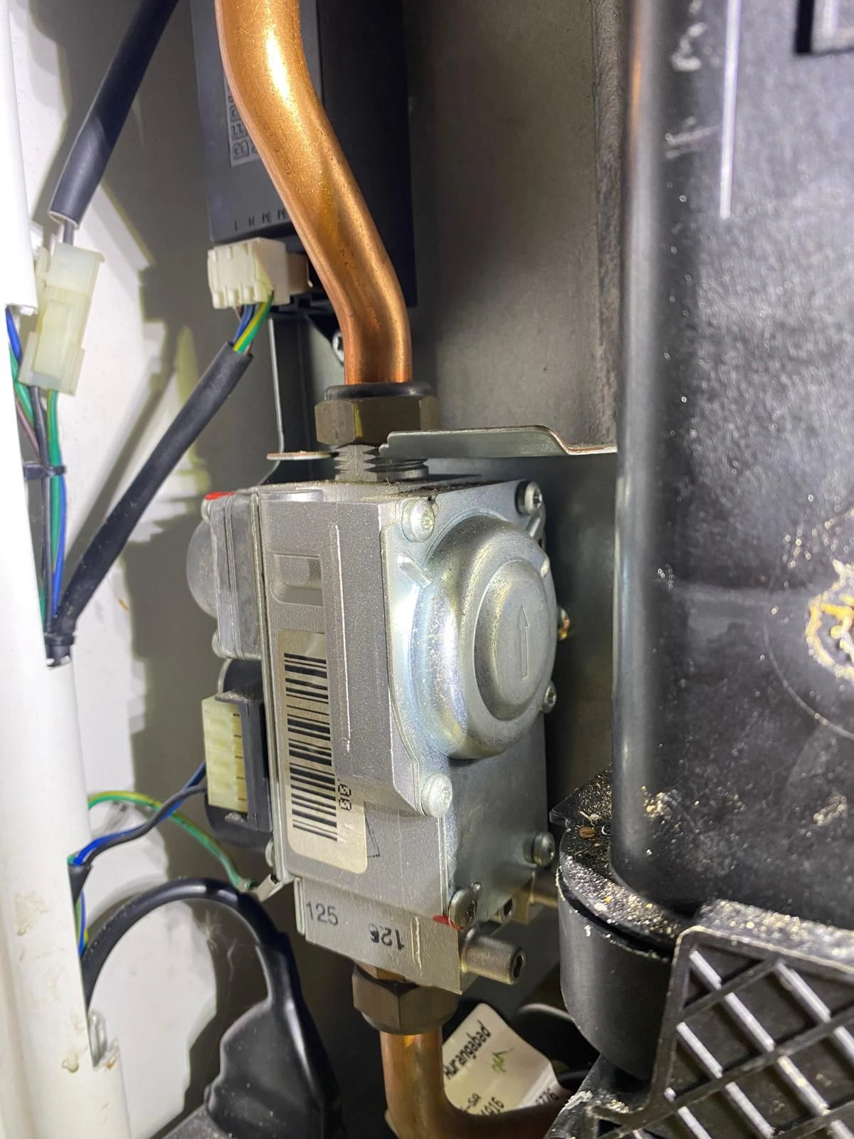 Gas Safe engineer repairing a combi boiler in Prestwich. Diagnostics, parts replacement and safety checks