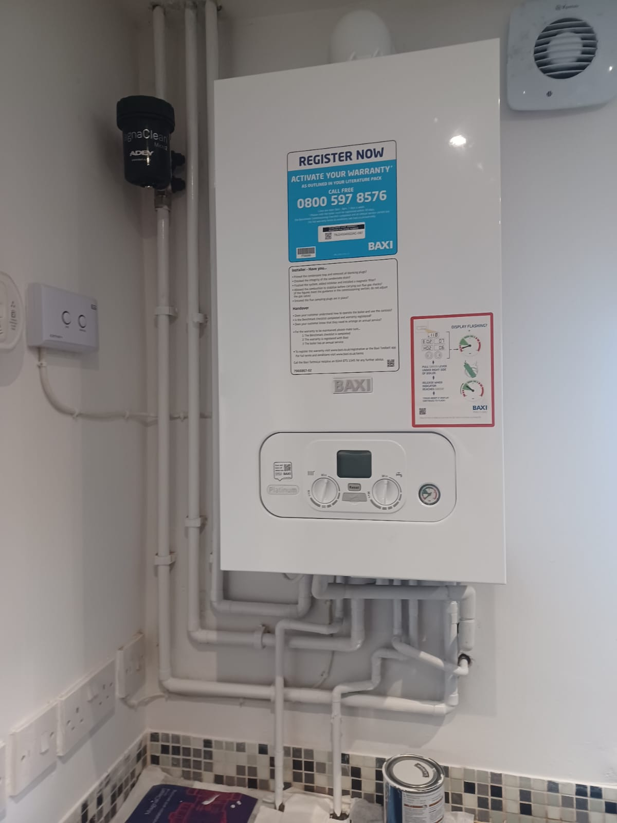 Gas Safe engineer repairing a combi boiler in Stockport. Diagnostics, parts replacement and safety checks