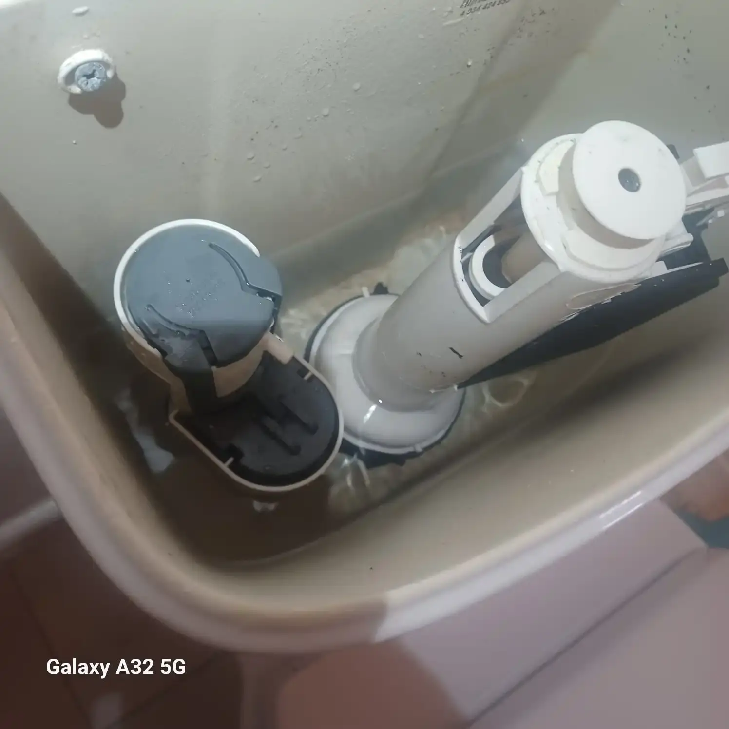 Under-sink leak repair on kitchen pipework